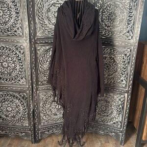 Free People poncho black. super cute. in great preowned condition. size XS